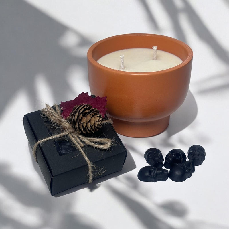 Orange Candle Bowl, Black Skull Heads.