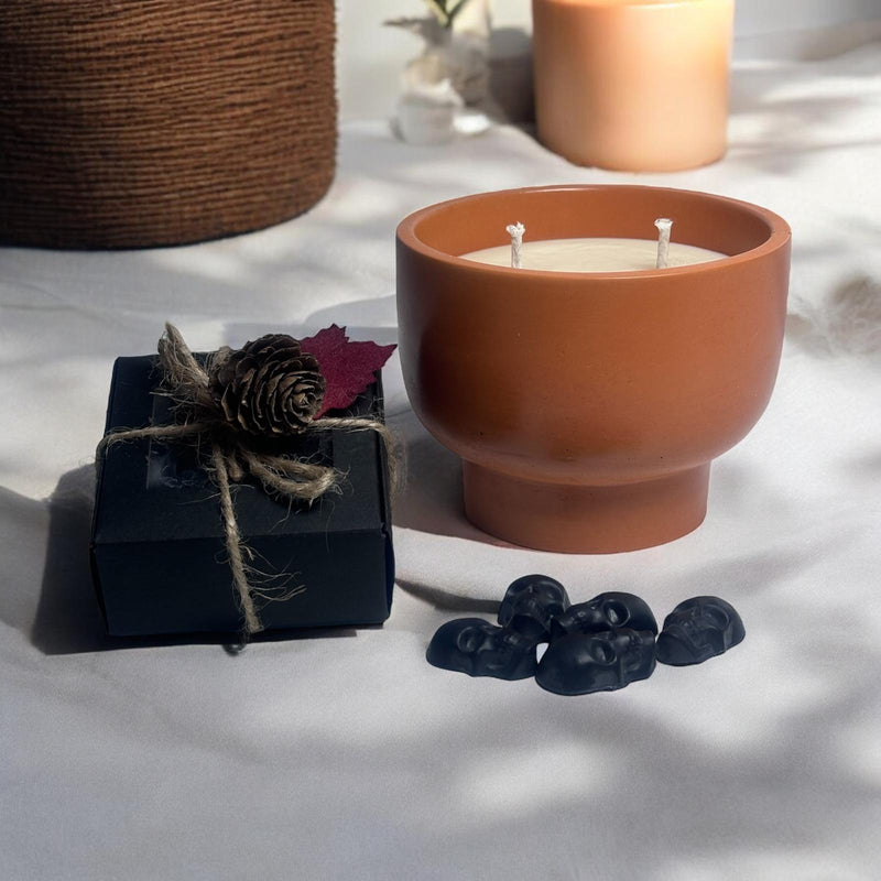 Orange Candle Bowl, Black Skull Heads.