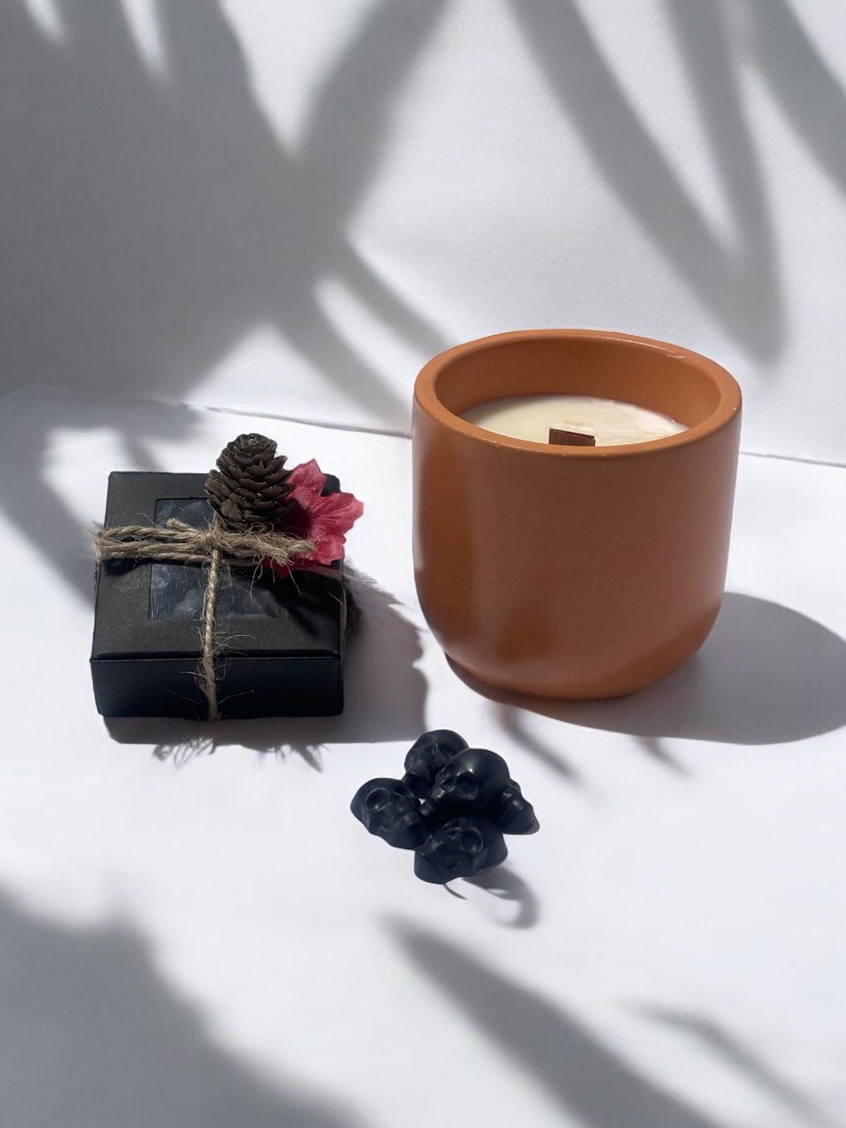 Orange Classic Candle, Black Skull Heads.