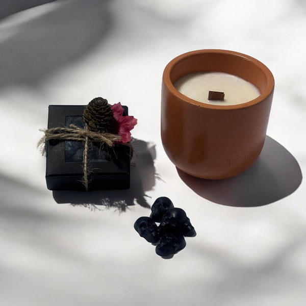 Orange Classic Candle, Black Skull Heads.